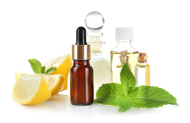 Beautiful spa composition with lemon essential oil on white background, closeup