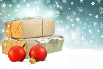 Christmas background with red christmas balls and gift boxes in snow on shine night background with...