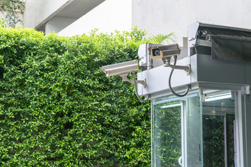 Security system for house / home - cctv cameras with toll booth, green plant background