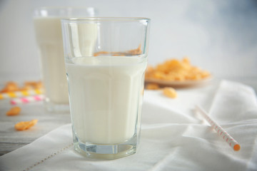 Delicious milkshake in glass on table