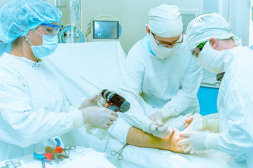 Doctors operate on a patient