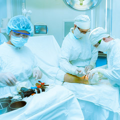 Doctors operate on a patient