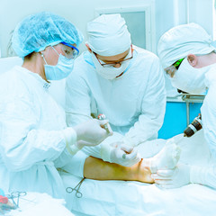 Doctors operate on a patient