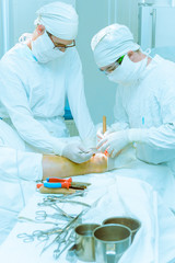Doctors operate on a patient