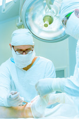 Doctors operate on a patient