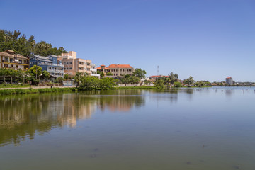 Fototapeta na wymiar Buildings reflecting on the lake in Torres
