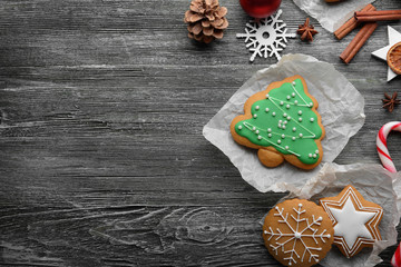 Composition of cookies and Christmas decor on wooden table
