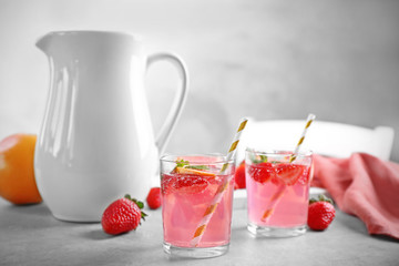 Glasses of refreshing drink on table
