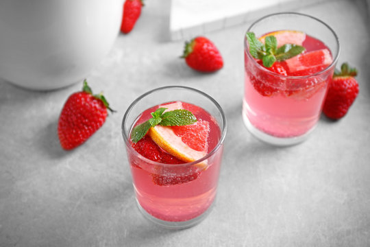 Glasses of refreshing drink on table