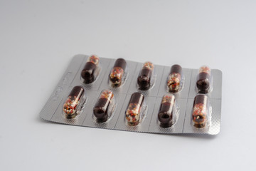 brown capsules in blister