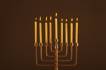 Menorah with candles for Hanukkah on black background