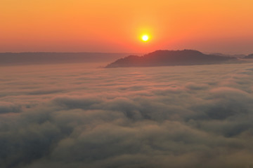 Obraz premium Mountain Mist in sunrise,mist on sunrise,mist over mountain during sunrise