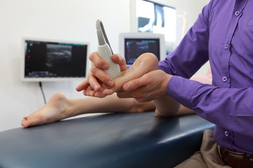 ultrasound of caucasian girl's foot - diagnosis, close up