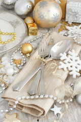 Fototapeta na wymiar Silver and golden Christmas Table Setting