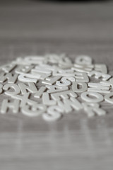 Blurred Background. Letters on wooden table. 