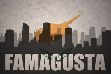 abstract silhouette of the city with text Famagusta at the vintage cyprus flag