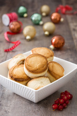 Christmas shortbread on wood and christmas ornaments
