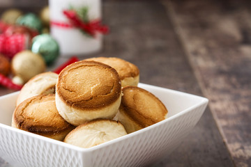 Christmas shortbread on wood and christmas ornaments
