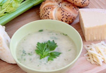 Vegetable celery soup with parmesan cheese and whole grain bread.
