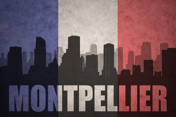 abstract silhouette of the city with text Montpellier at the vintage french flag