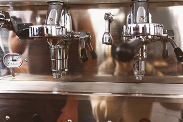 metalic espresso maker in a bar