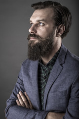 Portrait of an elegant young fashion man with beard and mustache