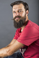 Portrait of a happy stylish man with beard and mustache
