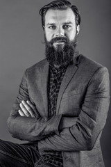 Fototapeta premium Portrait of an elegant young fashion man with beard and mustache