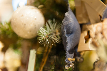 Christmas ball on the Christmas tree in the background with other ukrasheniyi and garlands. copyspace.