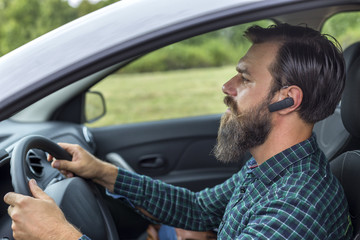 man speaking on the mobil phone using  headset