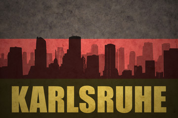 abstract silhouette of the city with text Karlsruhe at the vintage german flag