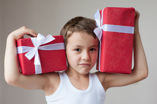 boy with two gifts show muscle