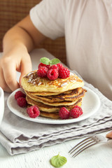 Child eating pancakes
