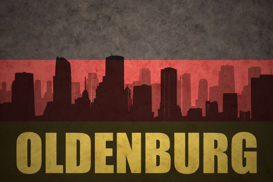 abstract silhouette of the city with text Oldenburg at the vintage german flag