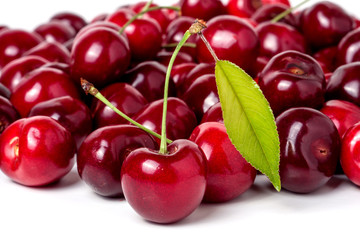 red cherry with leaf isolated on white background