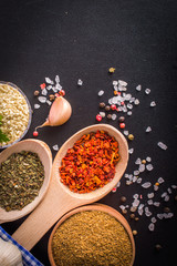 seasonings on black background