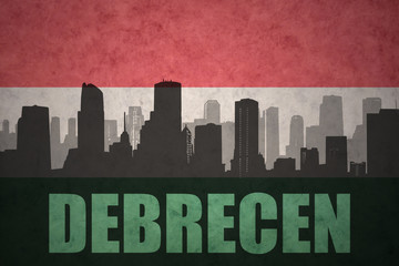 Naklejka premium abstract silhouette of the city with text Debrecen at the vintage hungarian flag