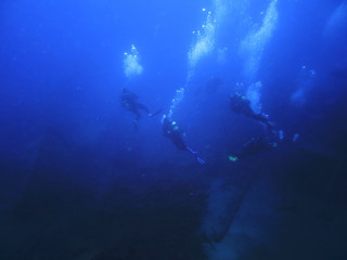 silhouette scuba diving. Sunken ship.