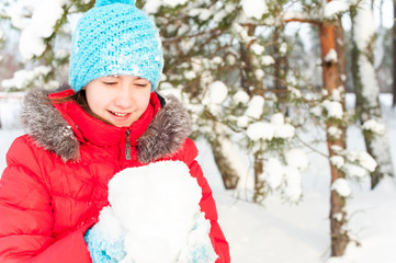 Unforgedable winter time! Young cheerful teenage girl holding so