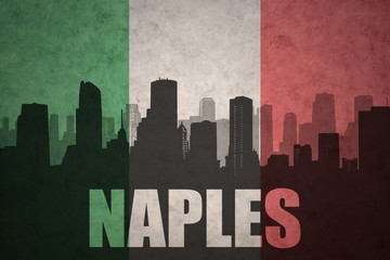 abstract silhouette of the city with text Naples at the vintage italian flag