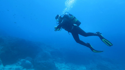 Fototapeta na wymiar Silhouette scuba diving.