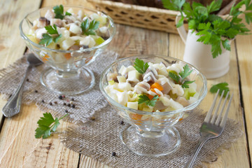 Salad with pickles, onions, mustard and apple. Appetizer on a fe