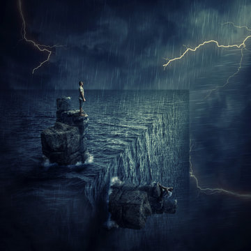 Conceptual Image With A Lost Man Sitting On A Rock Cliff Island, In The Middle Of The Ocean, Try To Find Himself In A Parallel World, Alternate Reality. Parallel Universe, Multiverse Fiction Theory.
