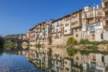 Reflection of old houses in the river of Valderrobres