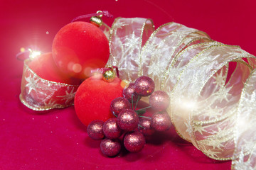 New Year's composition on a red background - ball and ribbon