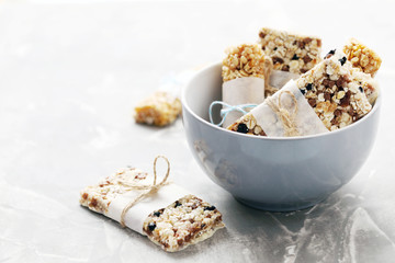Granola bar in bowl on a grey table