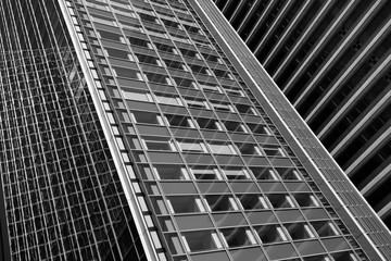 Skyscrapers with glass facade. Modern buildings in Paris business district. Concepts of economics, financial, future.  Copy space for text. Dynamic composition. Toned