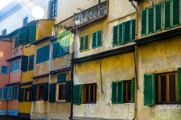 Fototapeta na wymiar Coloured walls of the shops on Ponte Vecchio, Florence, Italy