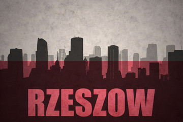 abstract silhouette of the city with text Rzeszow at the vintage polish flag
