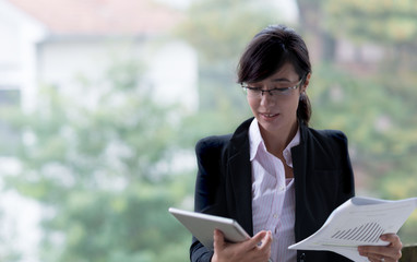 Young smiling black hair business woman. Selective focus and small depth of field.